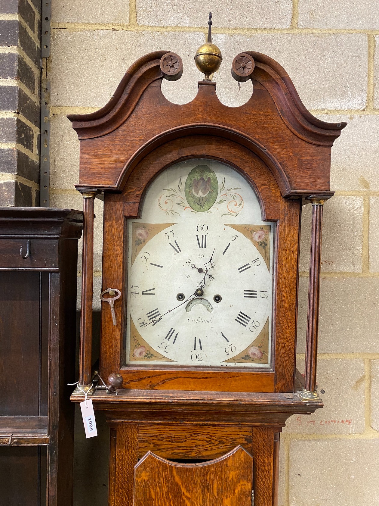 An early 19th century oak 8 day longcase clock, fusee movement, dial marked Crossland, height 236cm